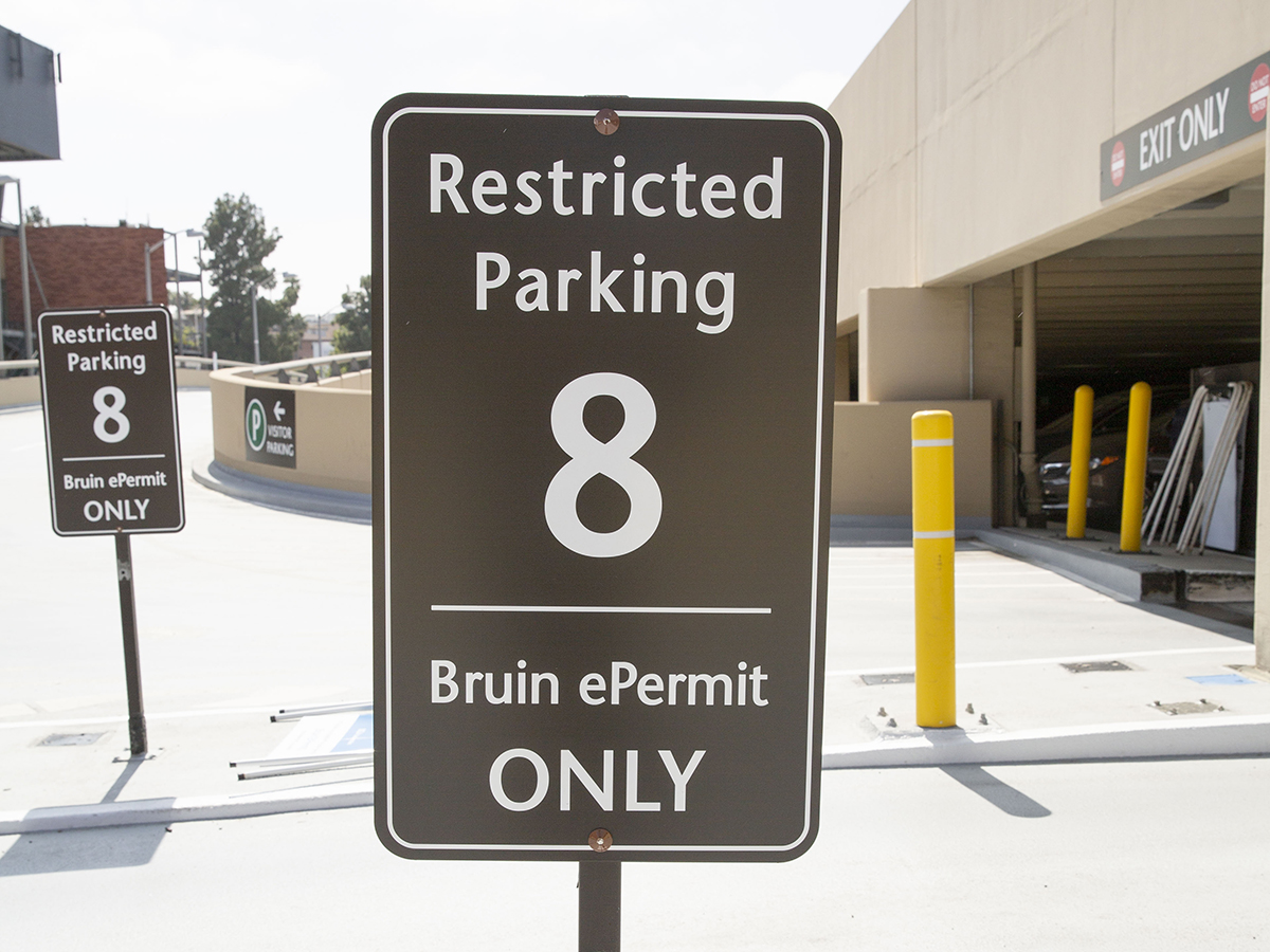 Restricted Parking sign on UCLA campus for a virtual permit-only parking facility